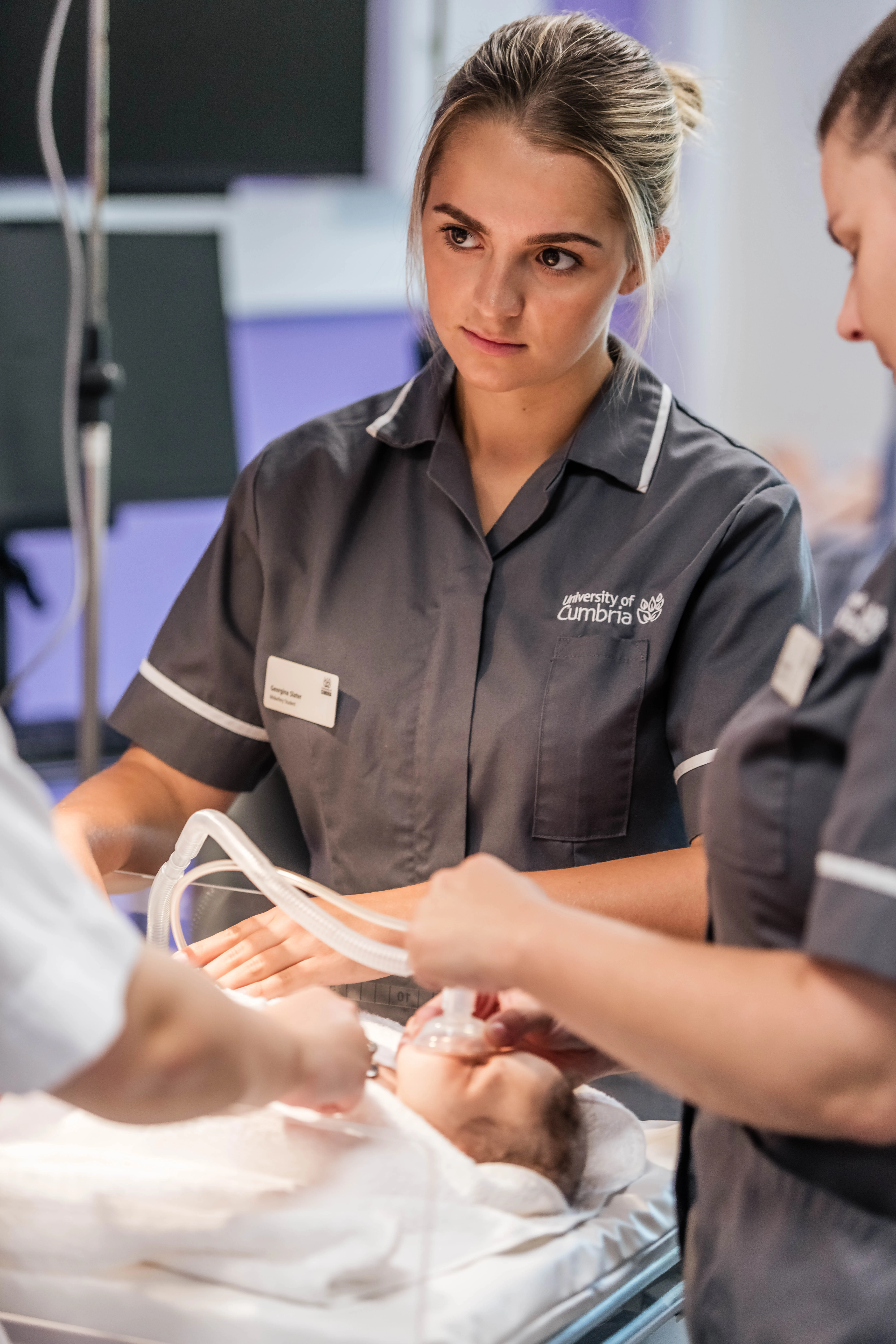 Midwifery students practising clinical skills