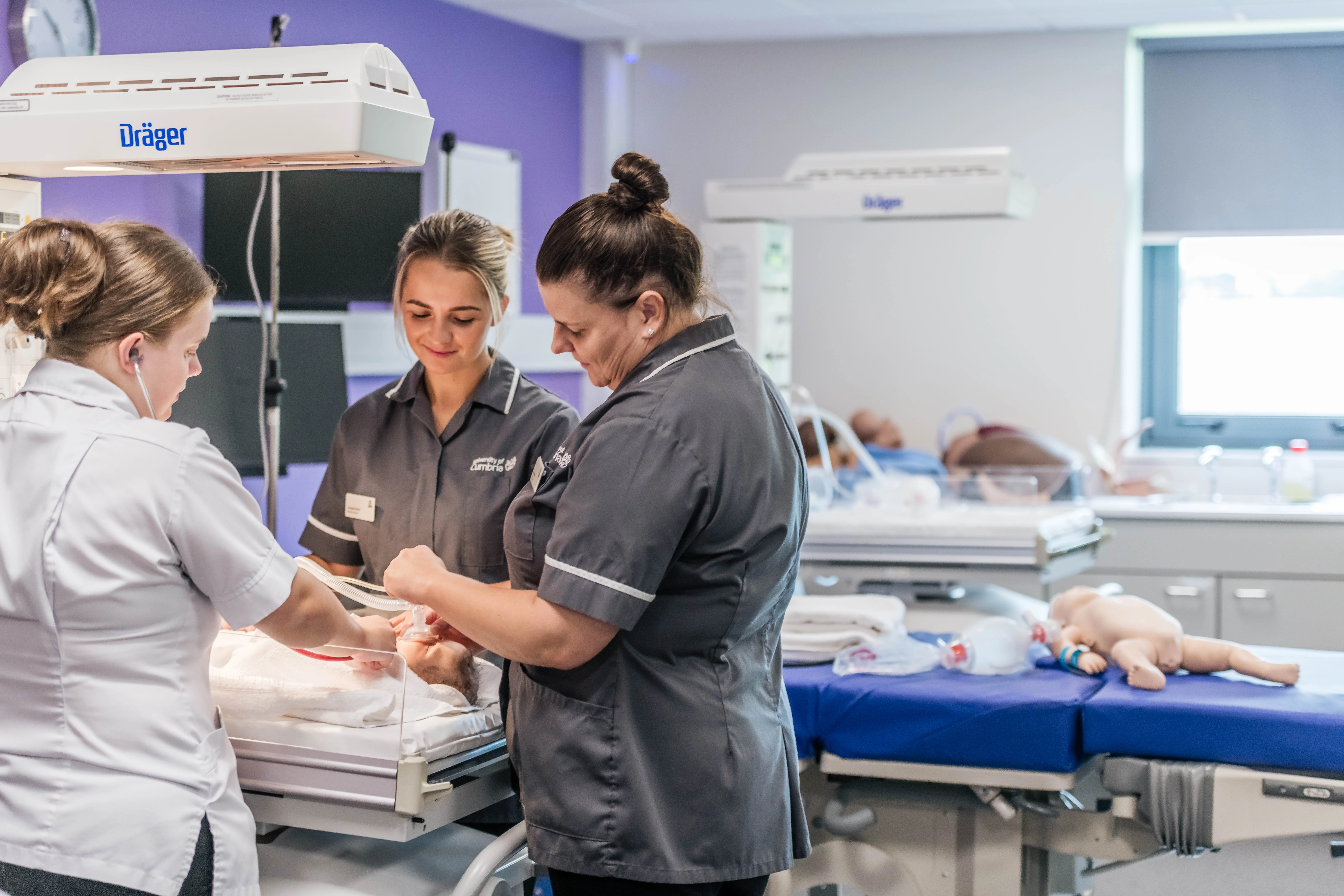Midwifery students practising clinical skills