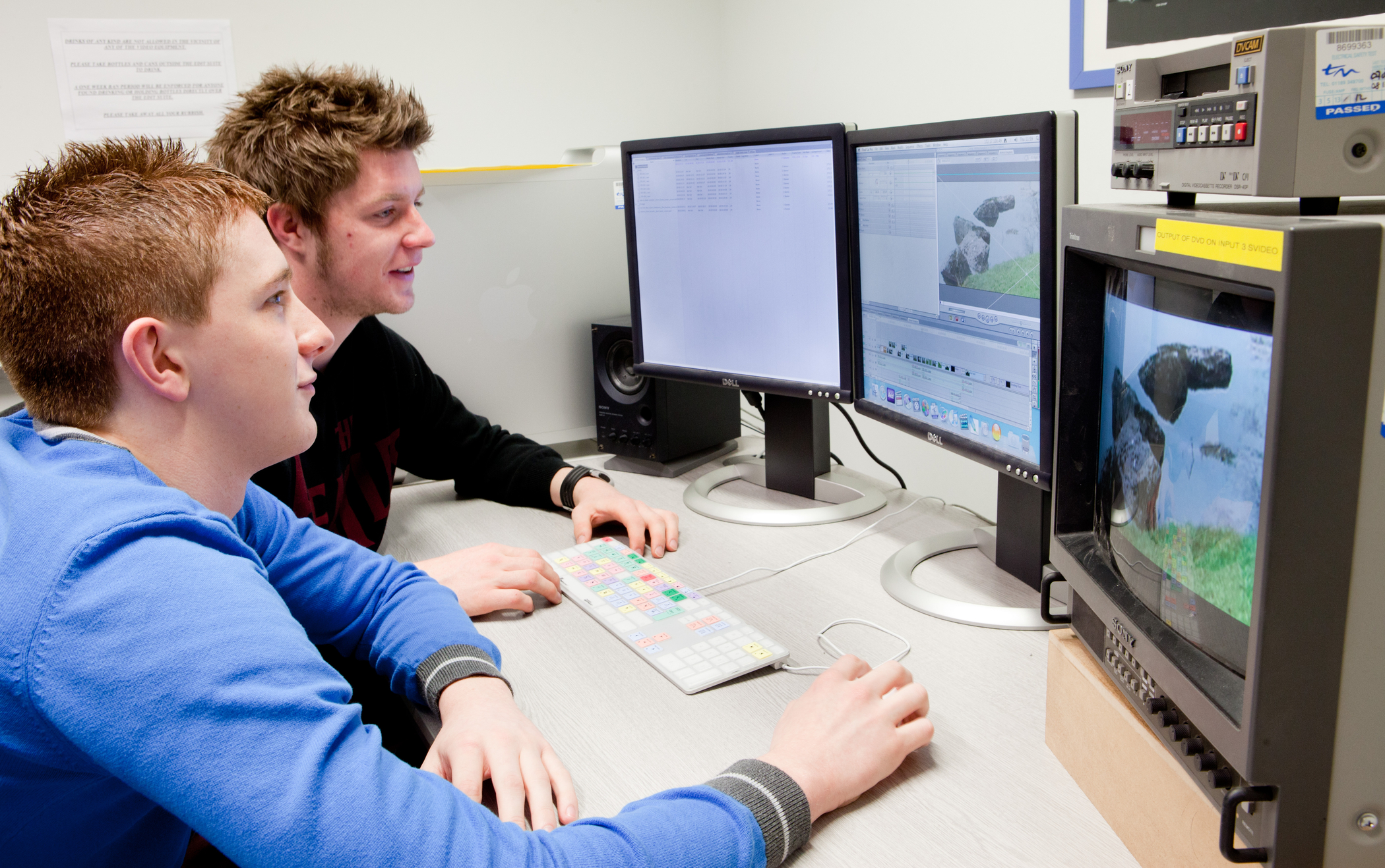 Students using editing software. Students using editing software.