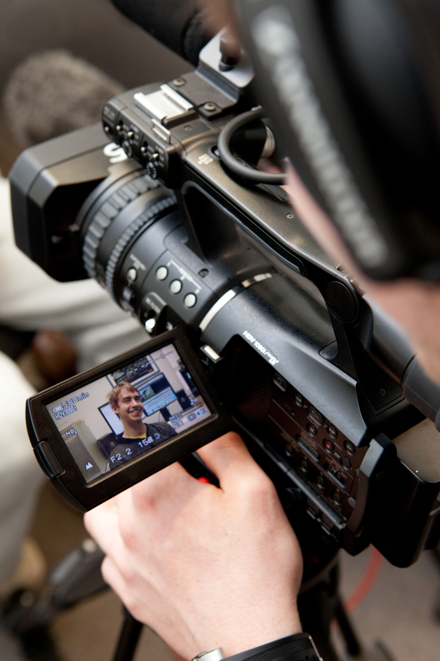 Student using recording equipment. Student using recording equipment.