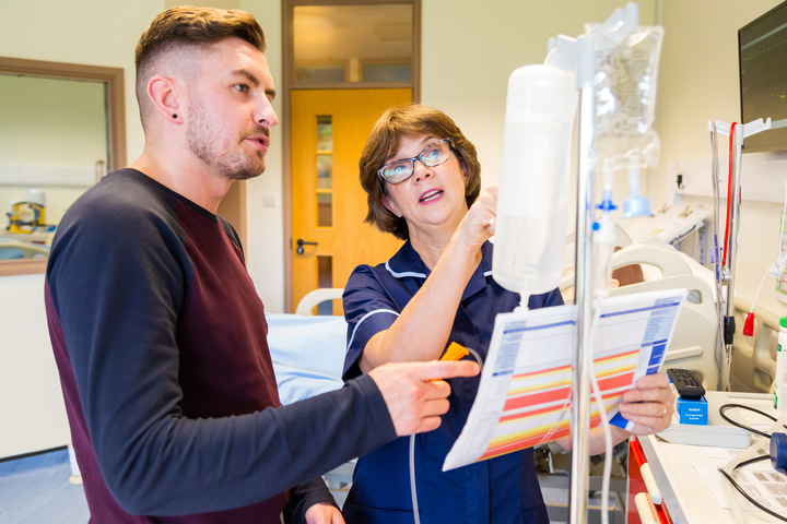 A nursing student being shown equipment in one of our simulation labs