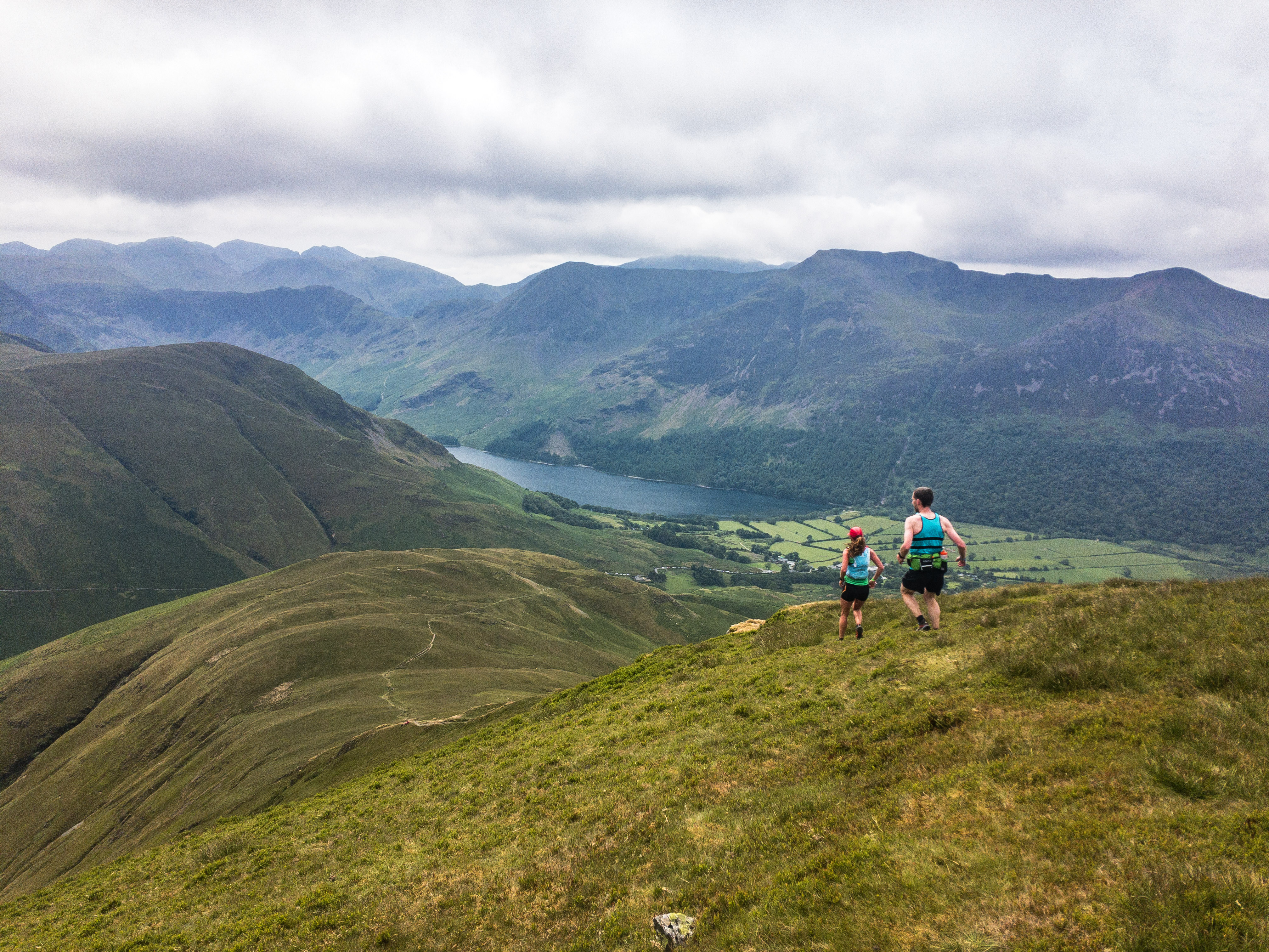 Students walking across a hilly landscape in the Lake District Students walking across a hilly landscape in the Lake District