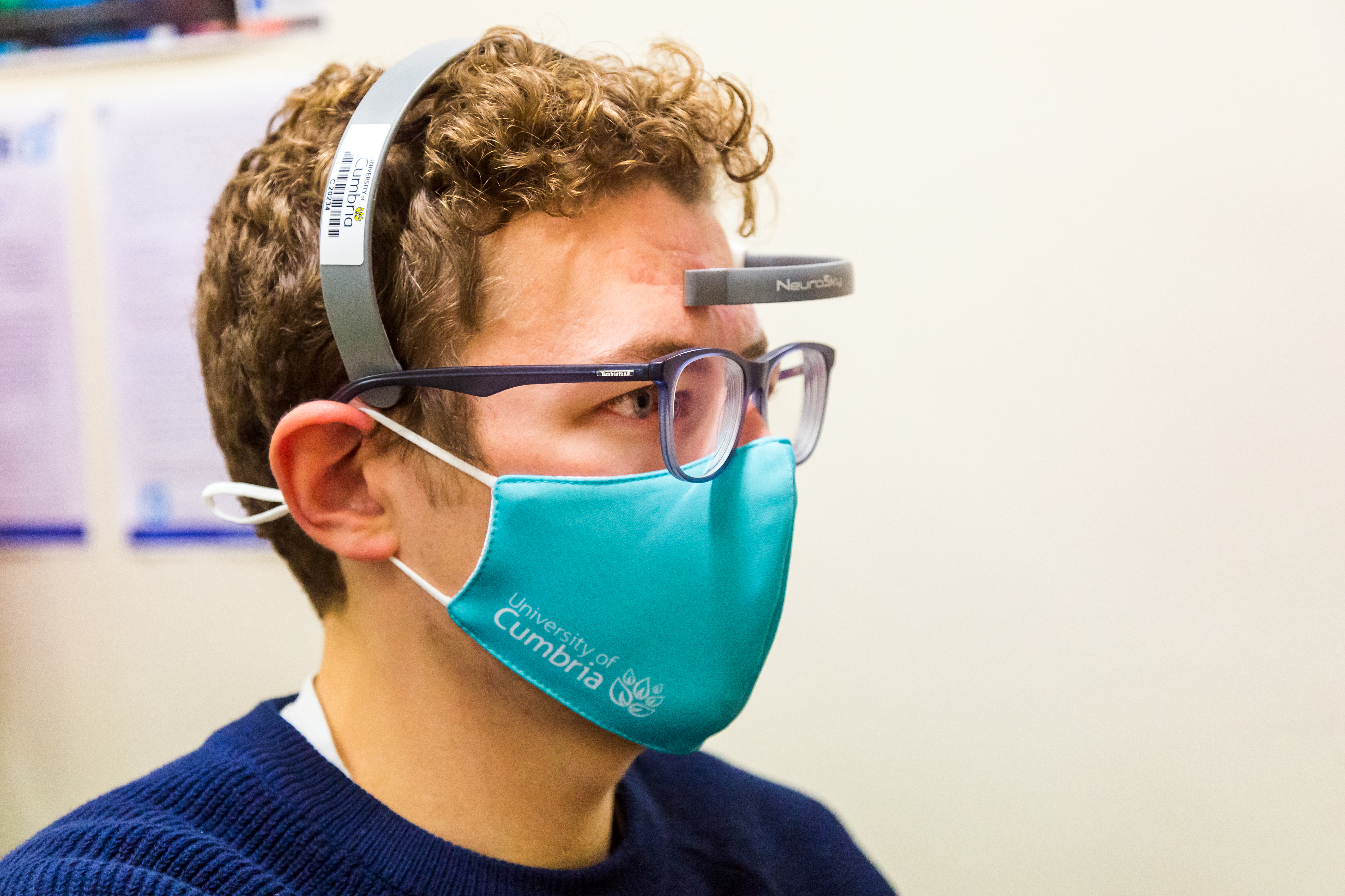 A technician using neuro-scanning equipment