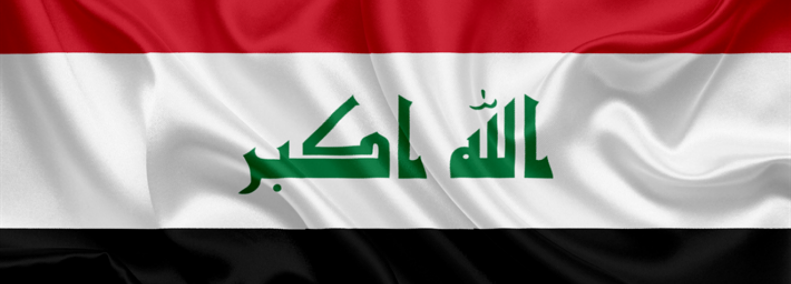 Flag of Iraq on a flagpole.