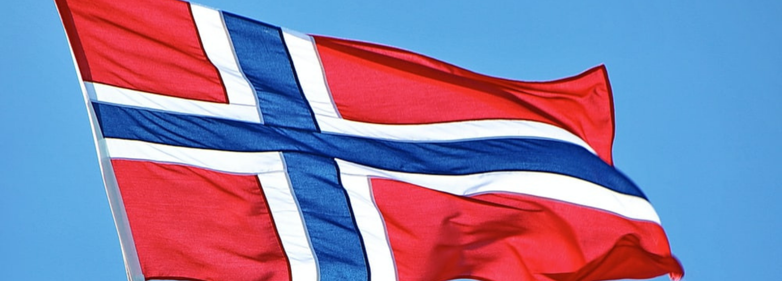 Norwegian flag on a pole.