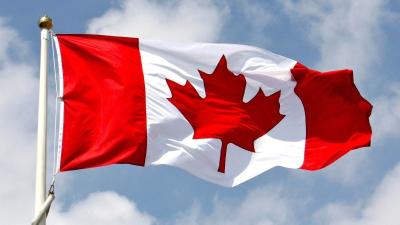 Canadian flag on a pole.