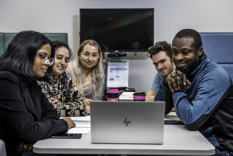 Students using a laptop